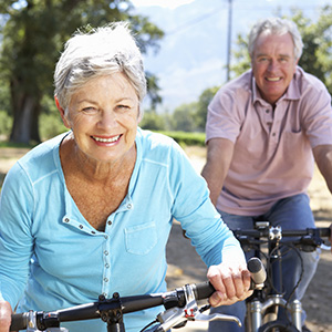 Senior citizens riding bikes at Cape Albeon