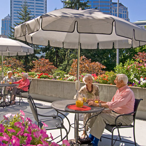 Senior man and woman enjoying patio at Horizon House