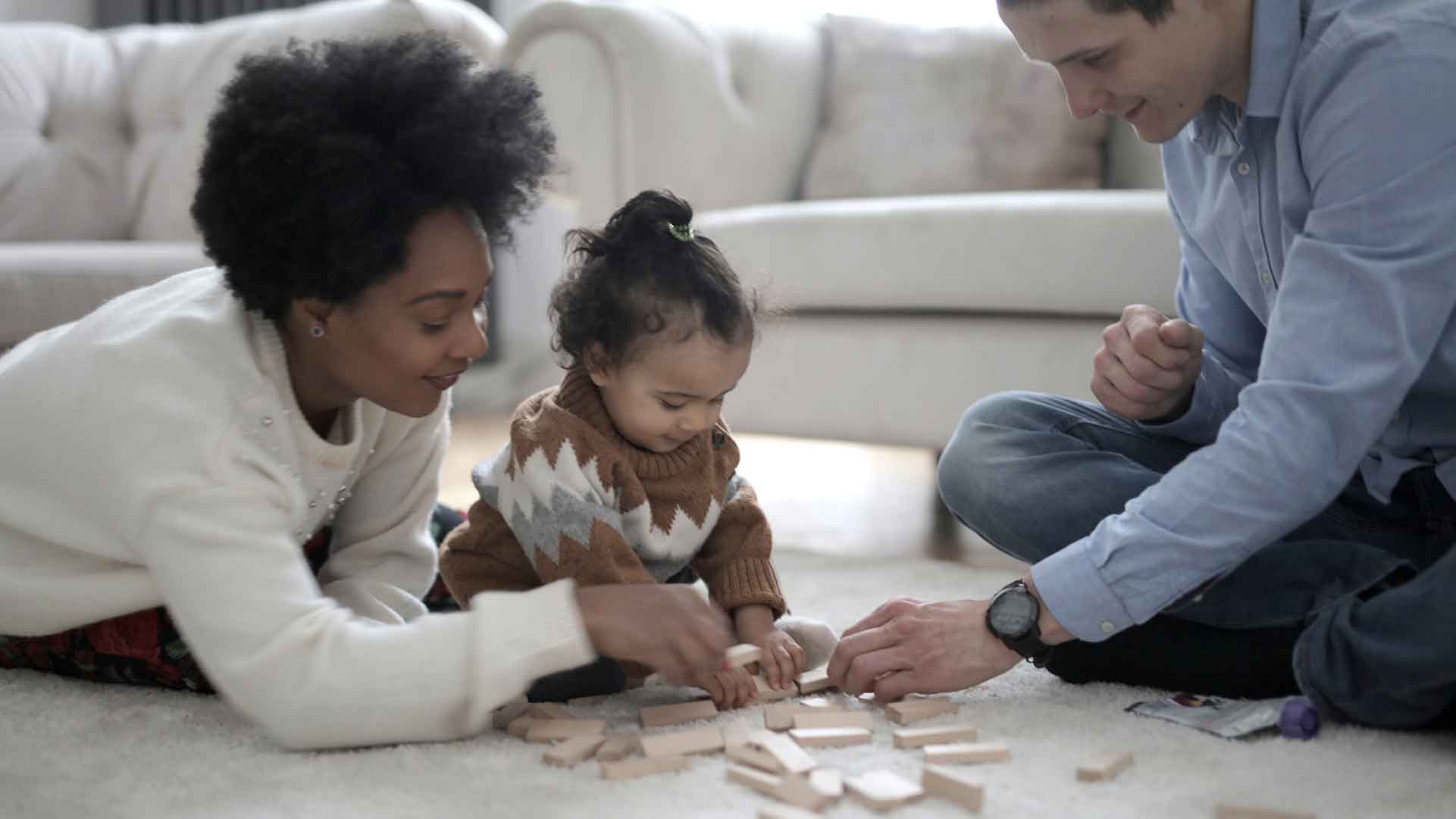 Multiracial family playing with blocks